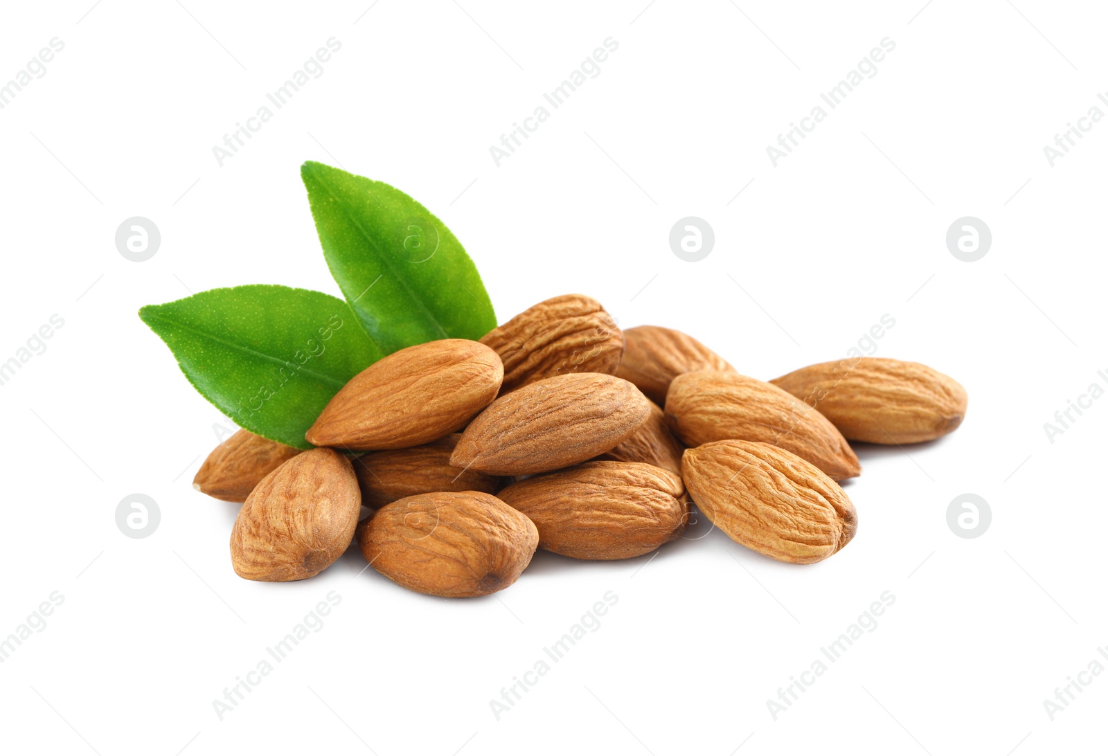 Photo of Organic almond nuts and green leaves on white background. Healthy snack