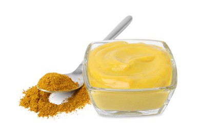 Photo of Tasty curry sauce and powder isolated on white