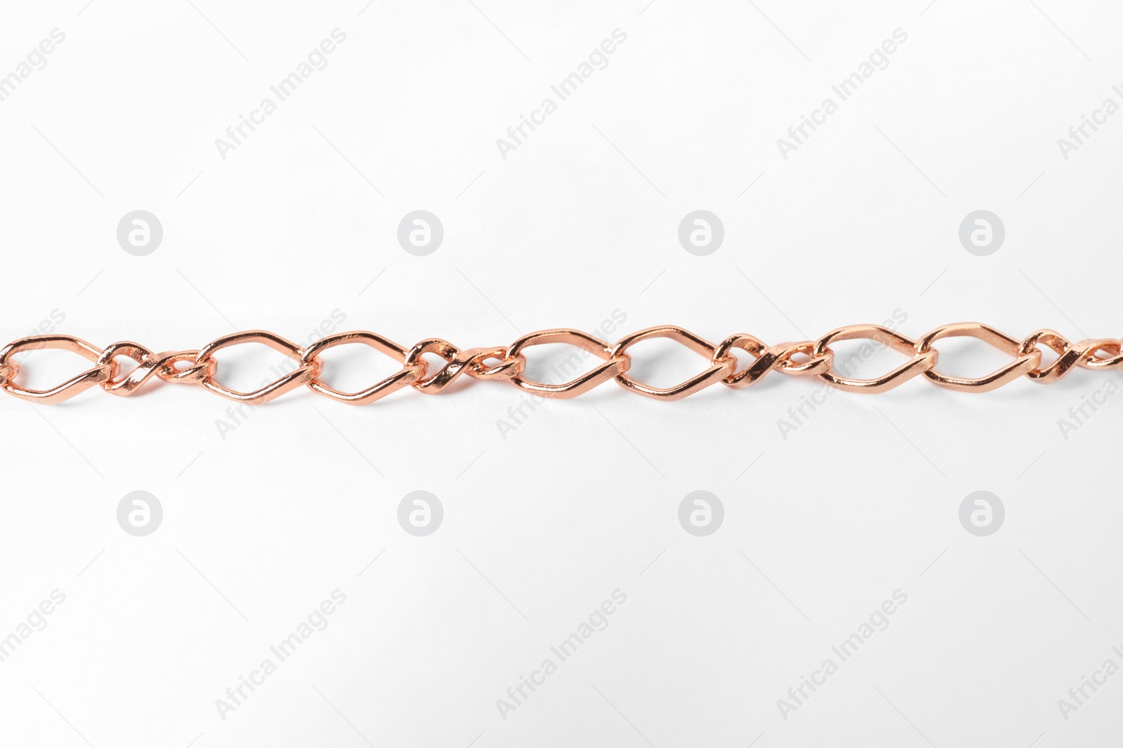 Photo of One metal chain on white background. Luxury jewelry