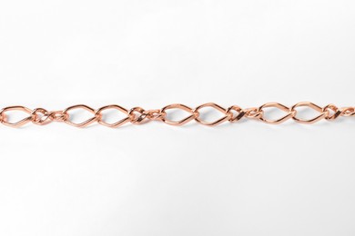 Photo of One metal chain on white background. Luxury jewelry