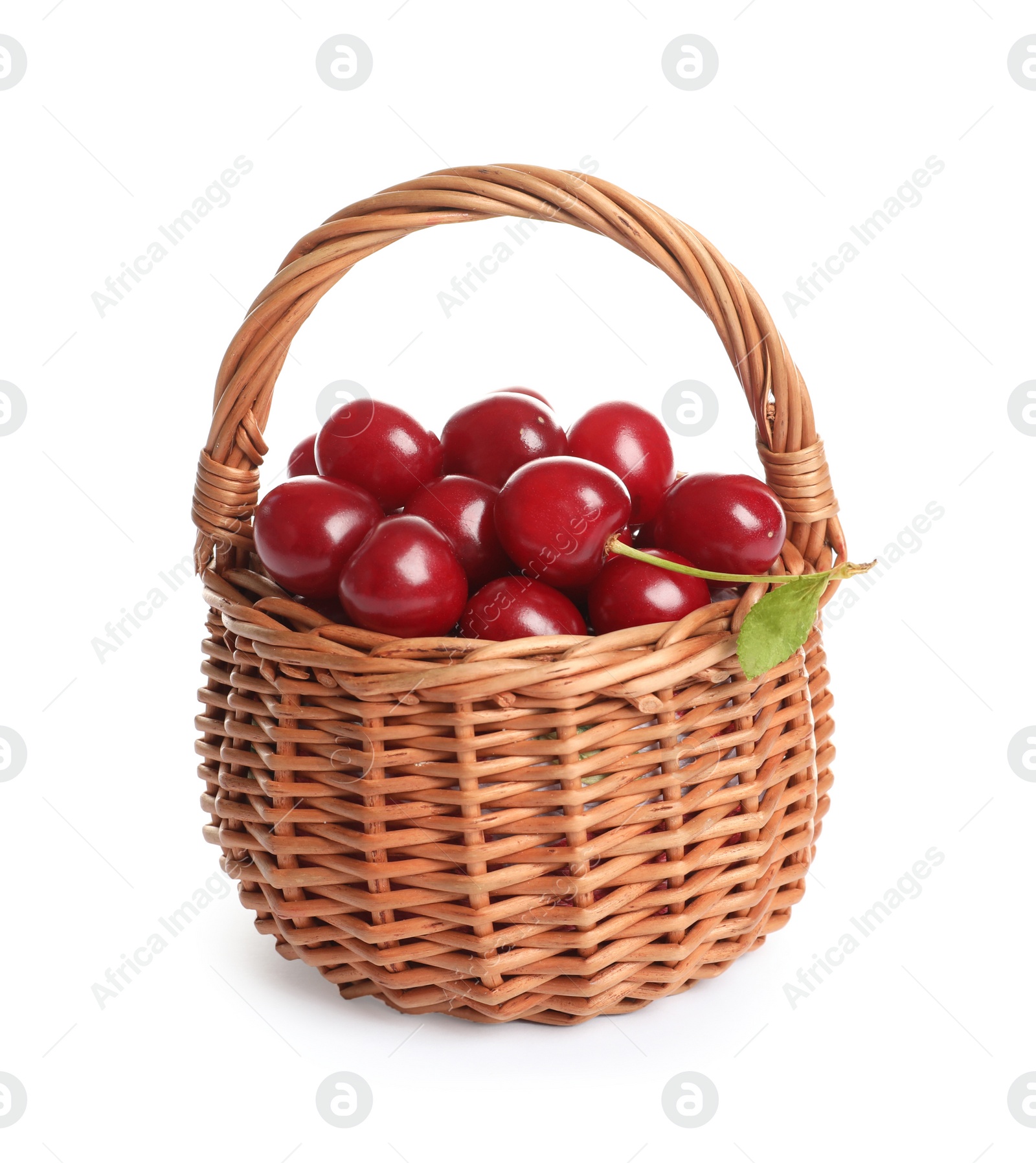 Photo of Wicker basket of delicious ripe sweet cherries on white background