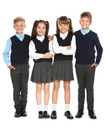 Photo of Little children in stylish school uniform on white background