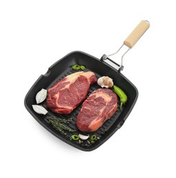 Photo of Grill pan with pieces of fresh beef meat, thyme and spices isolated on white