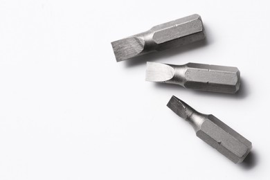 Photo of Three flathead screwdriver bits on white background