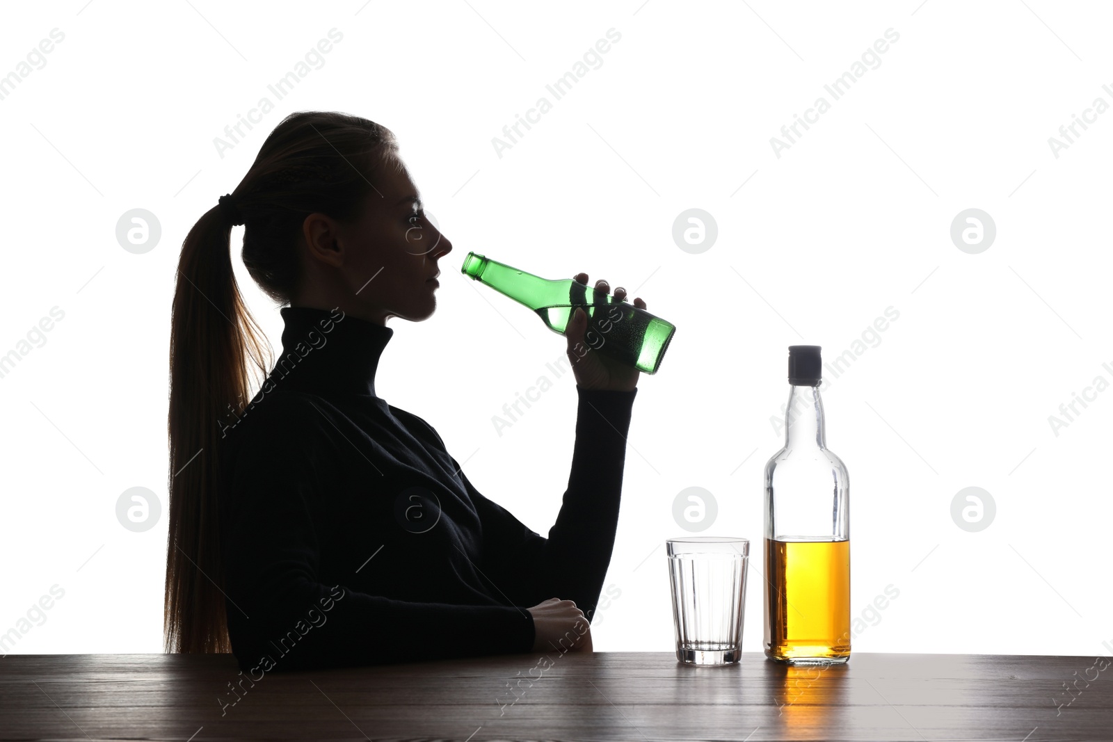 Photo of Alcohol addiction. Woman drinking beer on white background