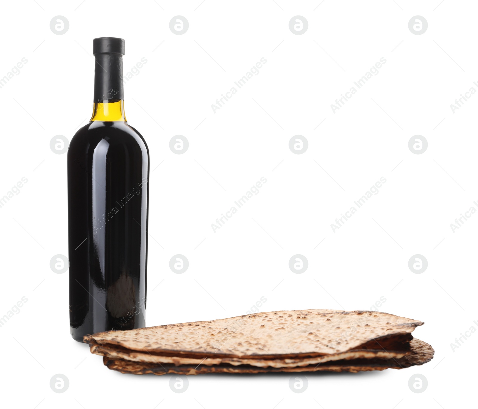 Photo of Tasty matzos and wine on white background. Passover (Pesach) celebration