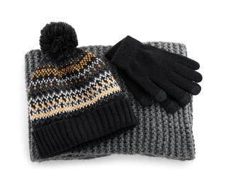 Photo of Woolen gloves, scarf and hat on white background, above view