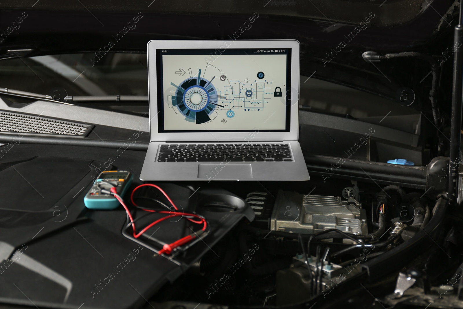 Photo of Laptop with diagram on auto engine. Modern car diagnostic