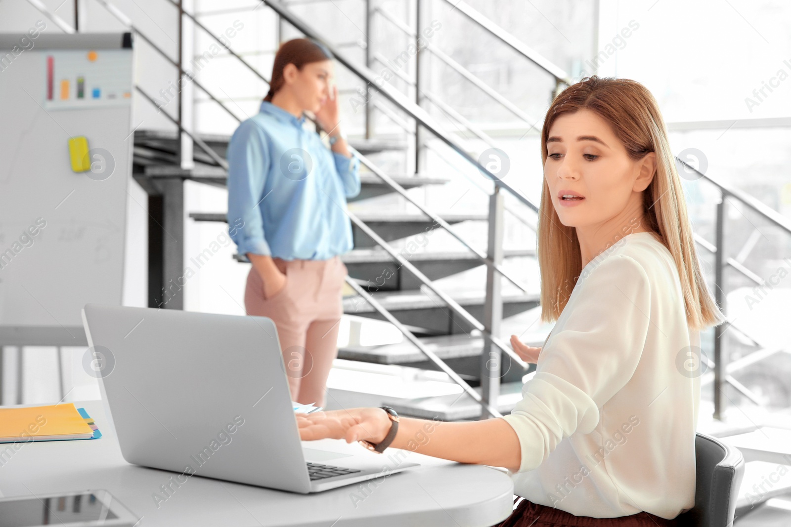 Photo of Office employees having argument at workplace