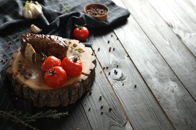 Delicious roasted rib served on wooden table. Space for text