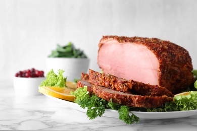 Plate with homemade delicious ham on marble table, space for text. Festive dinner