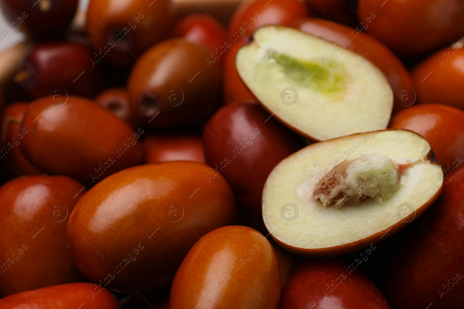 Photo of Closeup view of fresh Ziziphus jujuba fruits as background