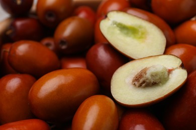 Photo of Closeup view of fresh Ziziphus jujuba fruits as background