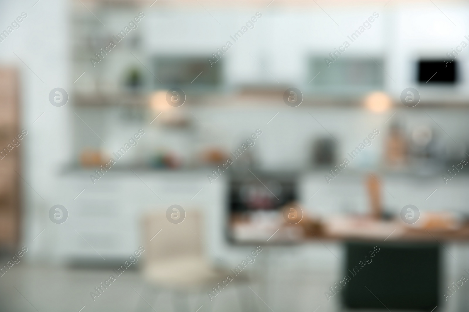 Photo of Blurred view of kitchen interior with bokeh effect