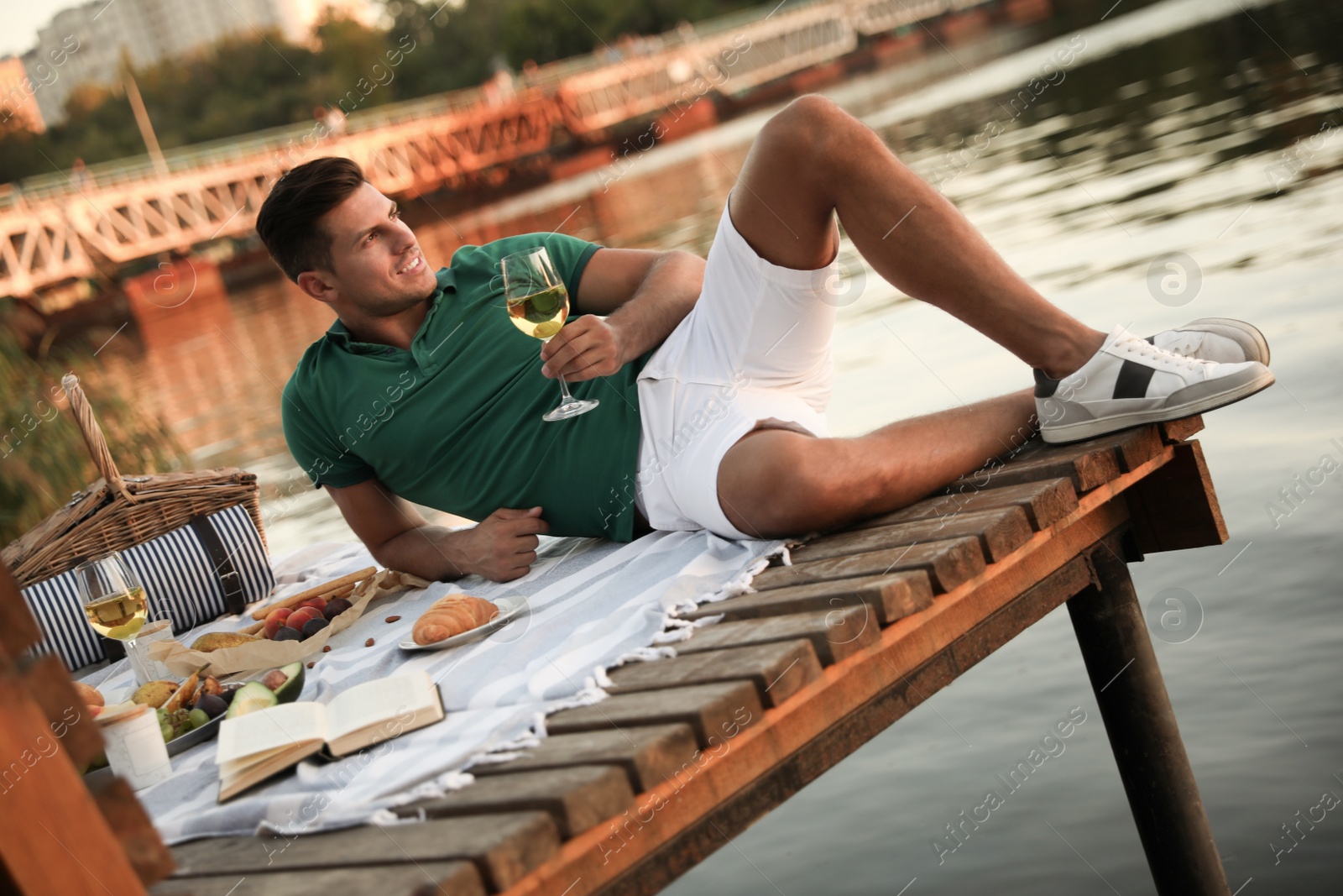 Photo of Man spending time on pier at picnic