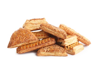 Photo of Heap of fresh tasty puff pastries on white background