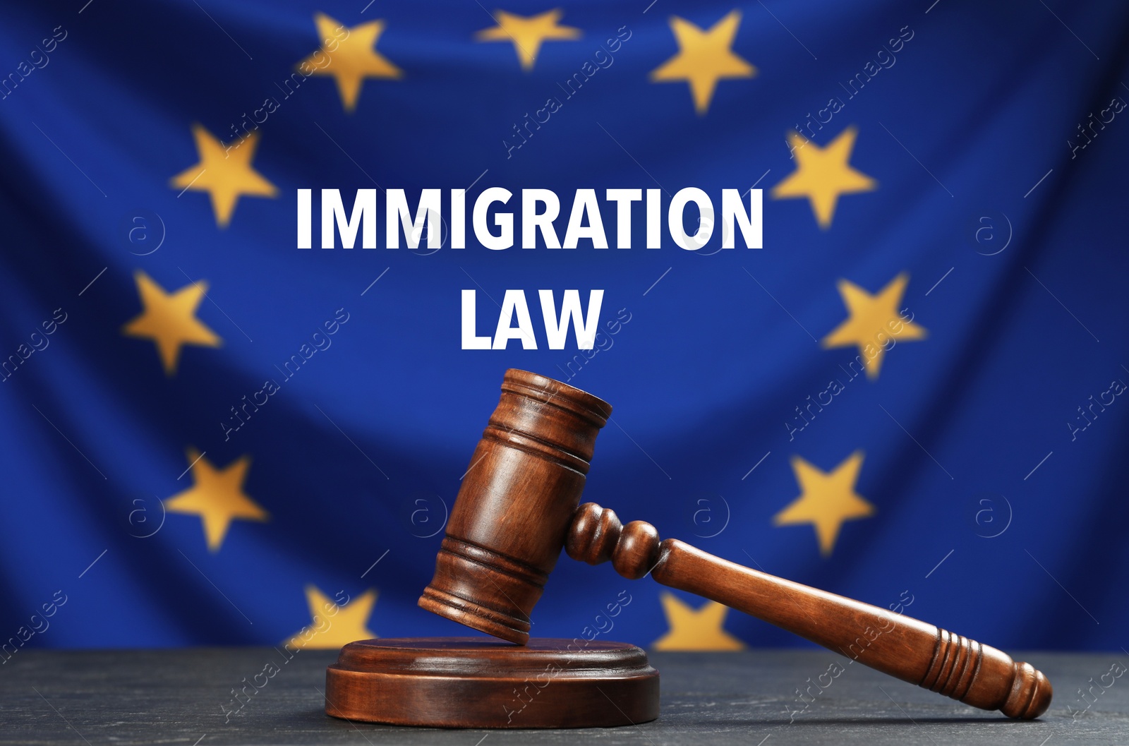 Image of Immigration law. Judge's gavel on black table against flag of European Union