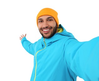 Photo of Smiling young man taking selfie on white background