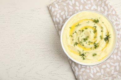 Photo of Freshly cooked homemade mashed potatoes on white wooden table, top view. Space for text