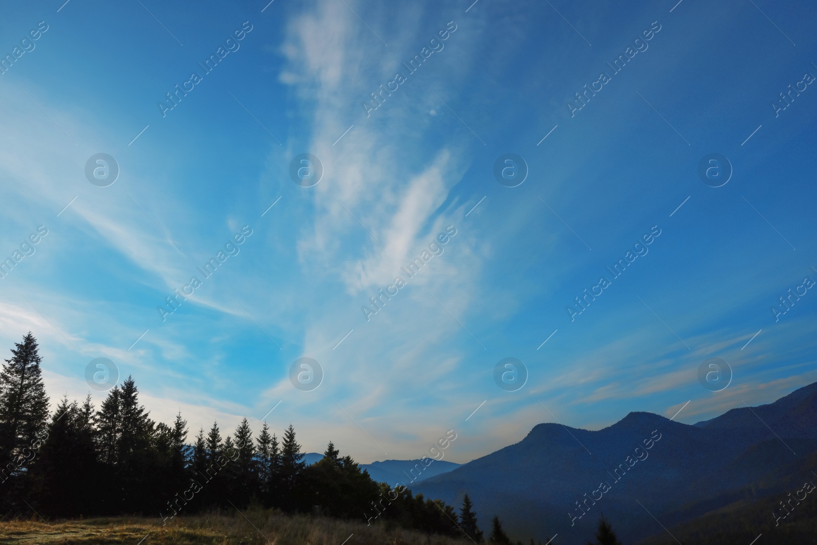 Photo of Picturesque view of blue sky with clouds over mountain landscape