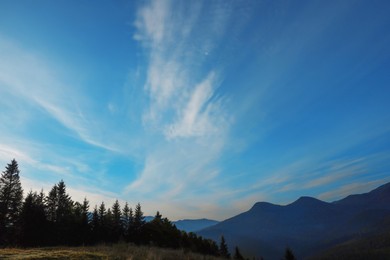 Picturesque view of blue sky with clouds over mountain landscape