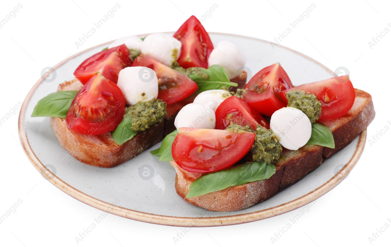 Photo of Delicious Caprese sandwiches with mozzarella, tomatoes, basil and pesto sauce isolated on white