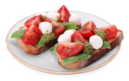 Delicious Caprese sandwiches with mozzarella, tomatoes, basil and pesto sauce isolated on white