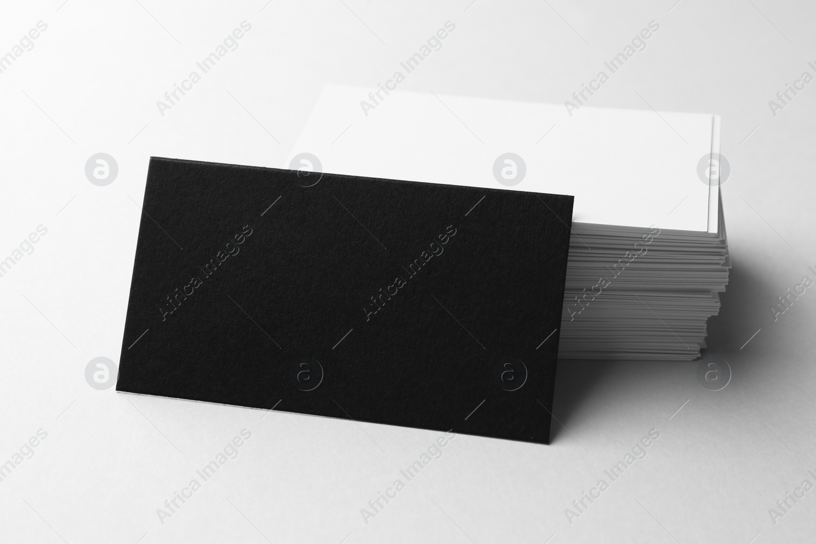 Photo of Blank business cards on white background, closeup. Mockup for design