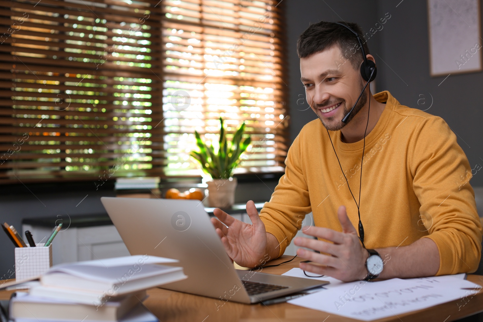 Photo of Teacher conducting online lesson at home during COVID-19 quarantine