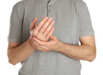 Photo of Man applying cream onto hand against white background, closeup