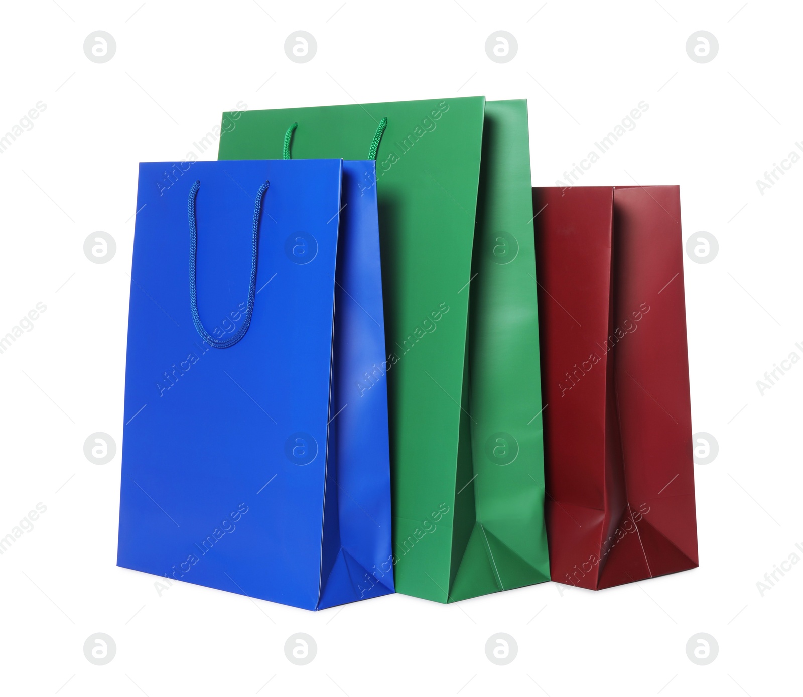 Photo of Colorful paper shopping bags isolated on white