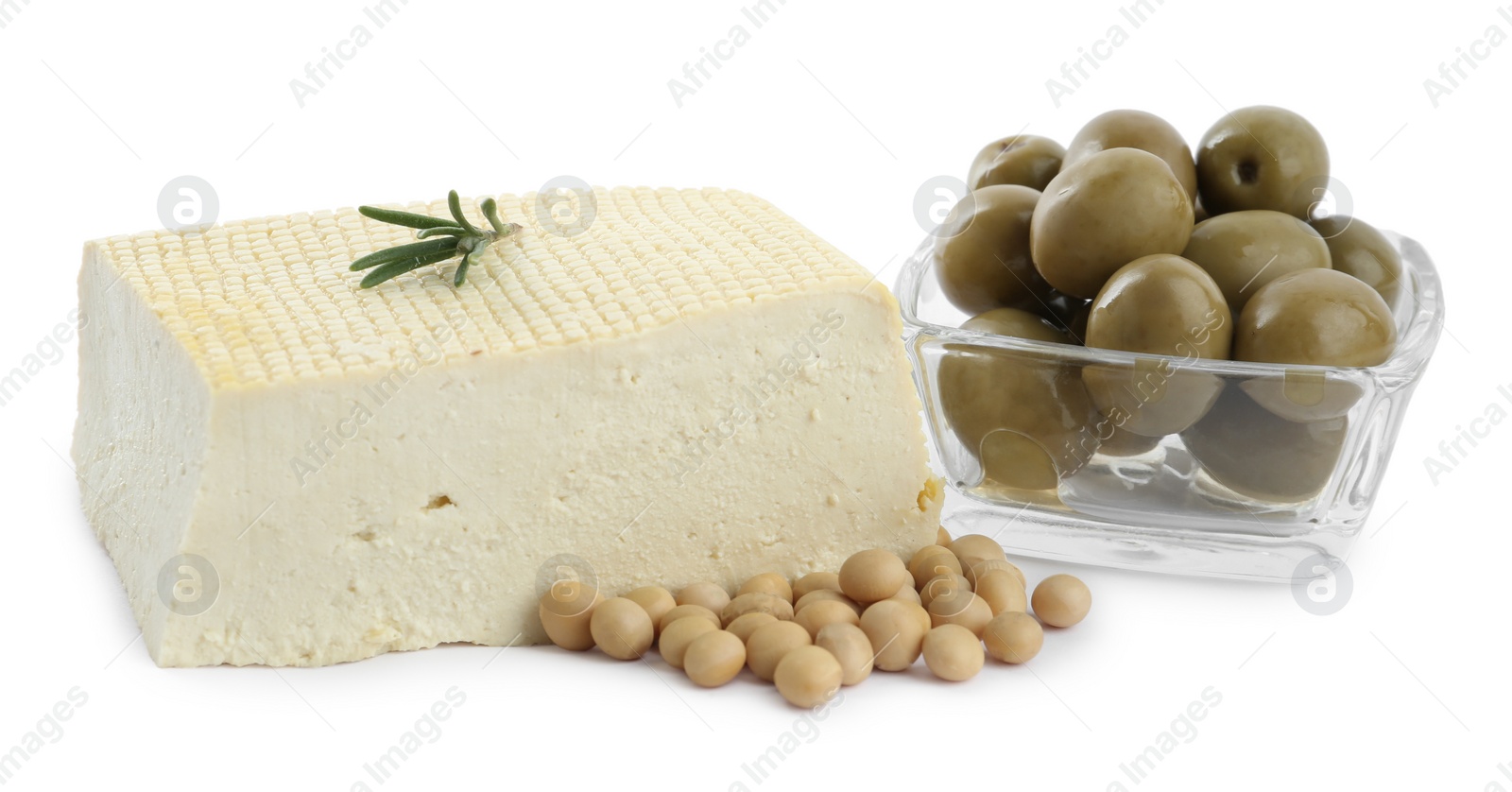 Photo of Piece of delicious tofu with rosemary, olives and soy on white background