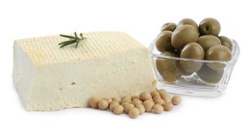 Piece of delicious tofu with rosemary, olives and soy on white background