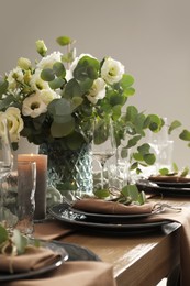 Festive table setting with beautiful floral decor indoors