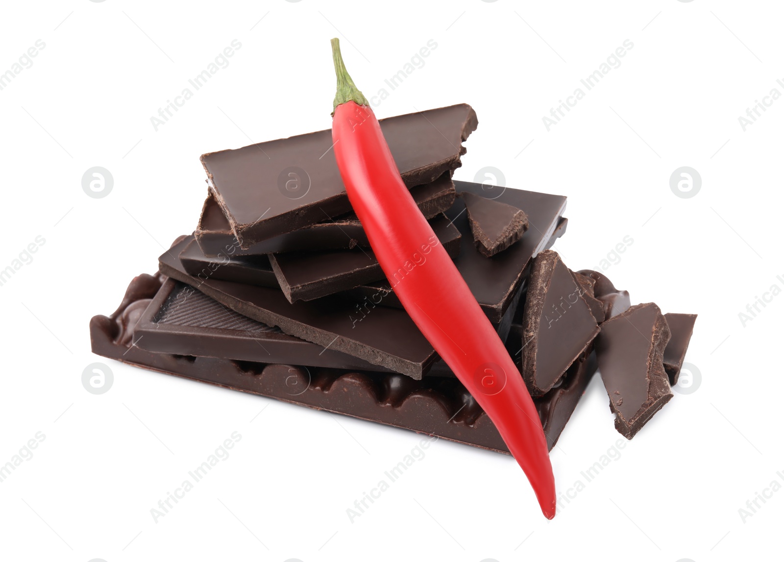 Photo of Red hot chili pepper and pieces of dark chocolate isolated on white