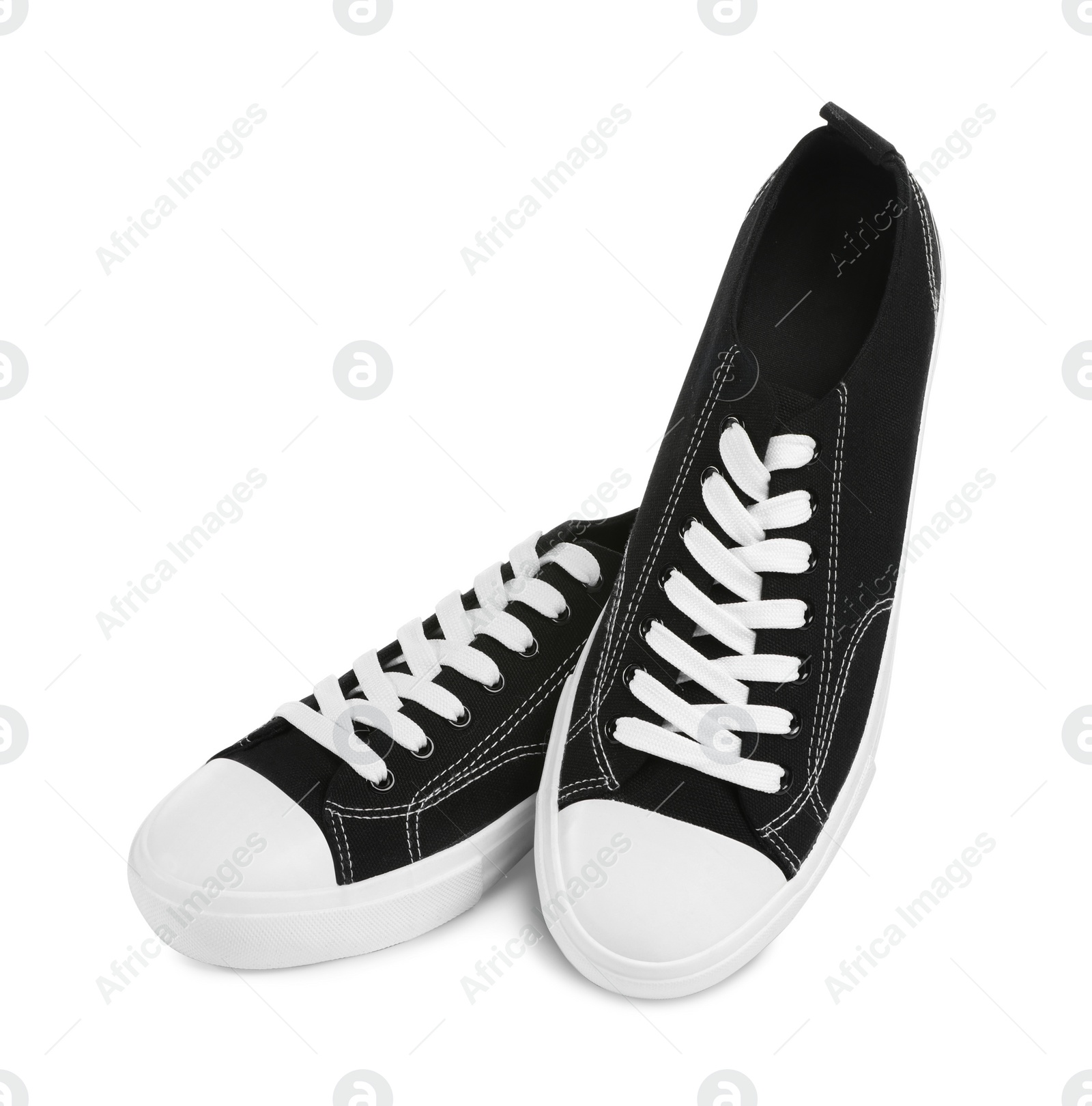 Photo of Pair of black classic old school sneakers isolated on white