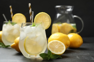 Photo of Natural lemonade with mint on grey table. Summer refreshing drink