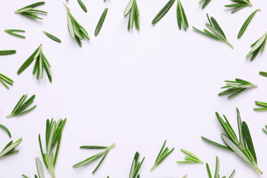 Frame made of fresh rosemary on white background, flat lay. Space for text