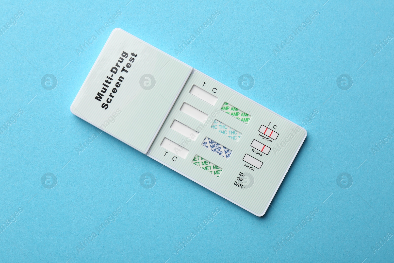 Photo of Multi-drug screen test on light blue background, top view