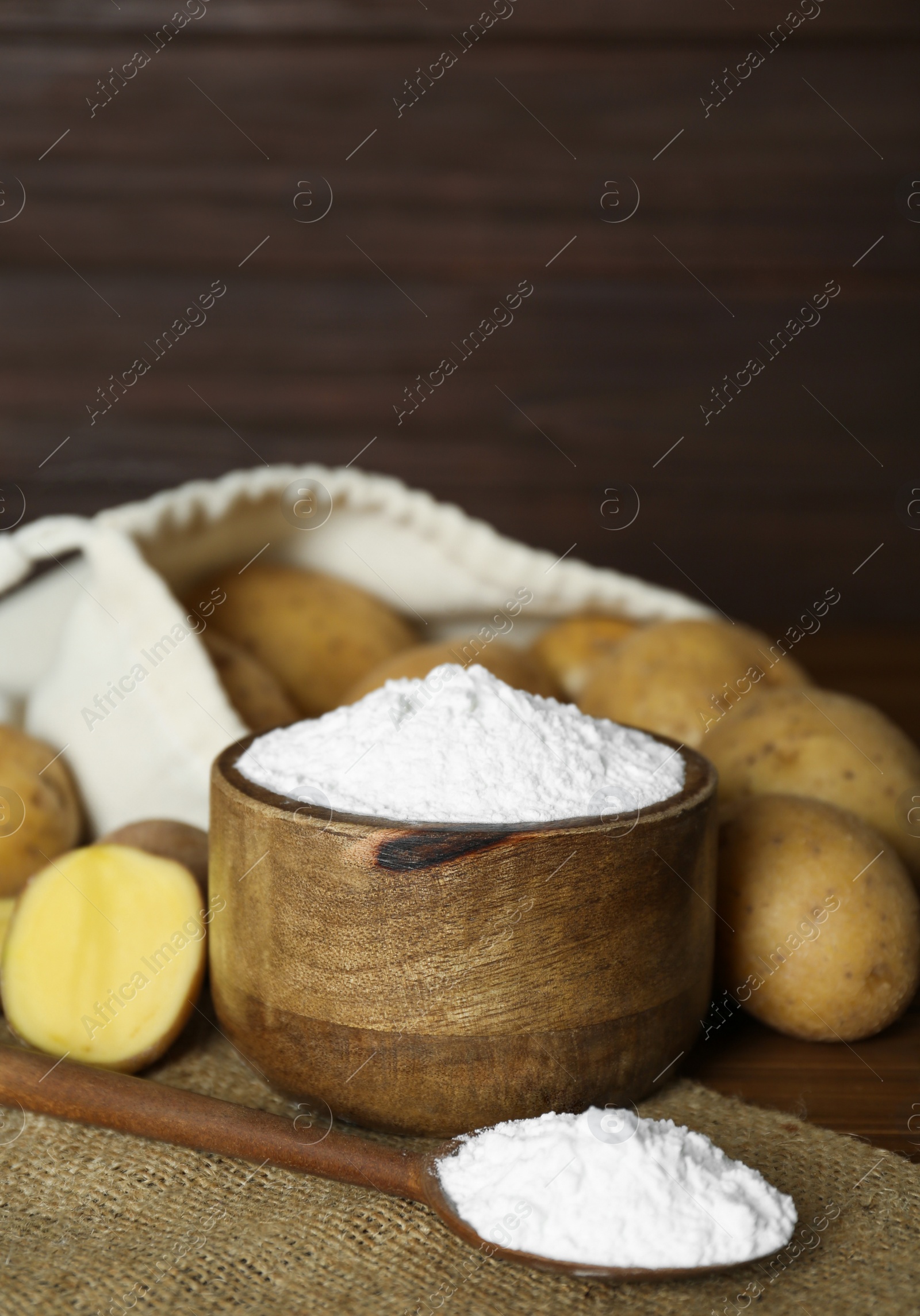 Photo of Starch and fresh raw potatoes on table. Space for text