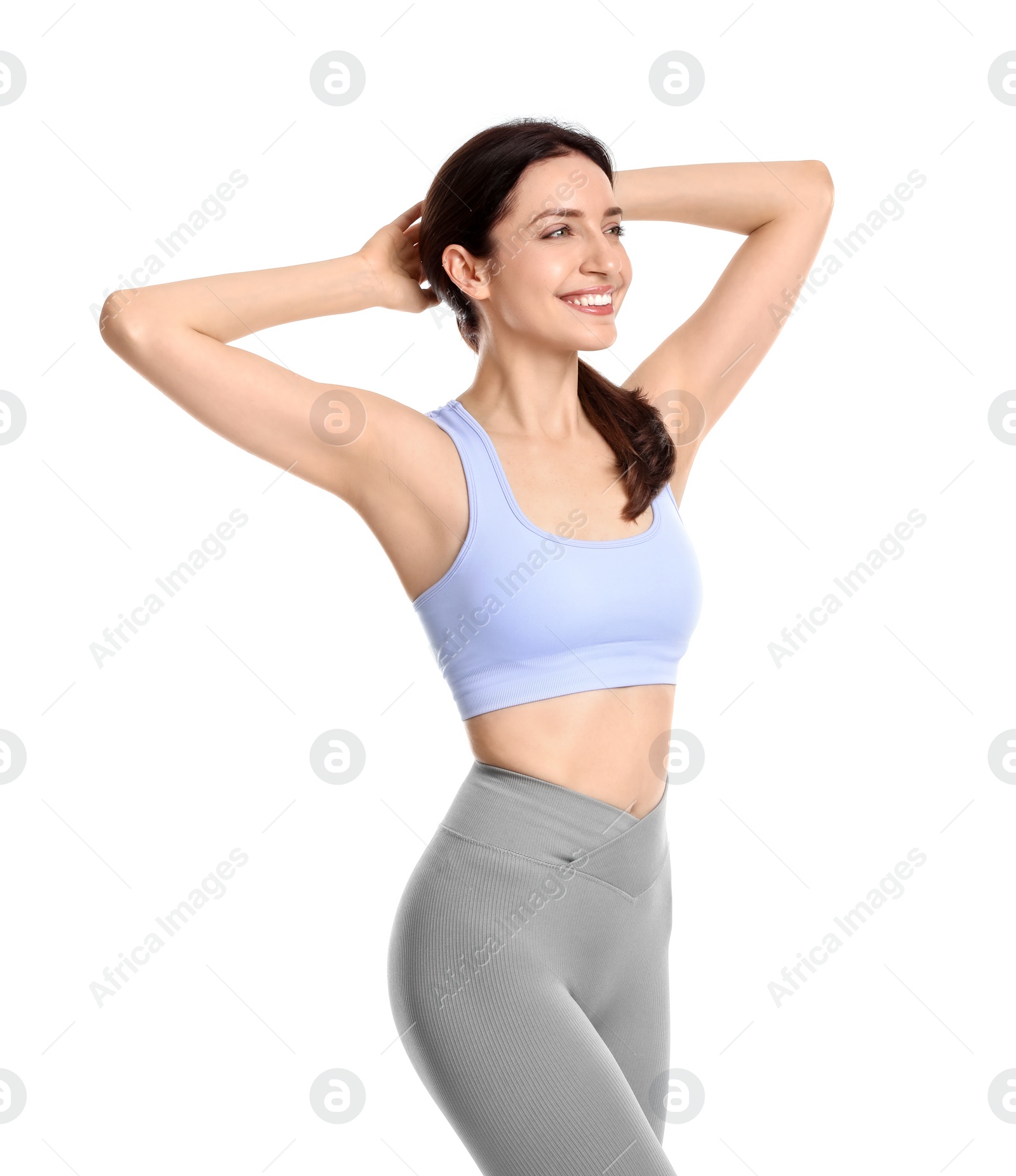 Photo of Happy young woman with slim body posing on white background