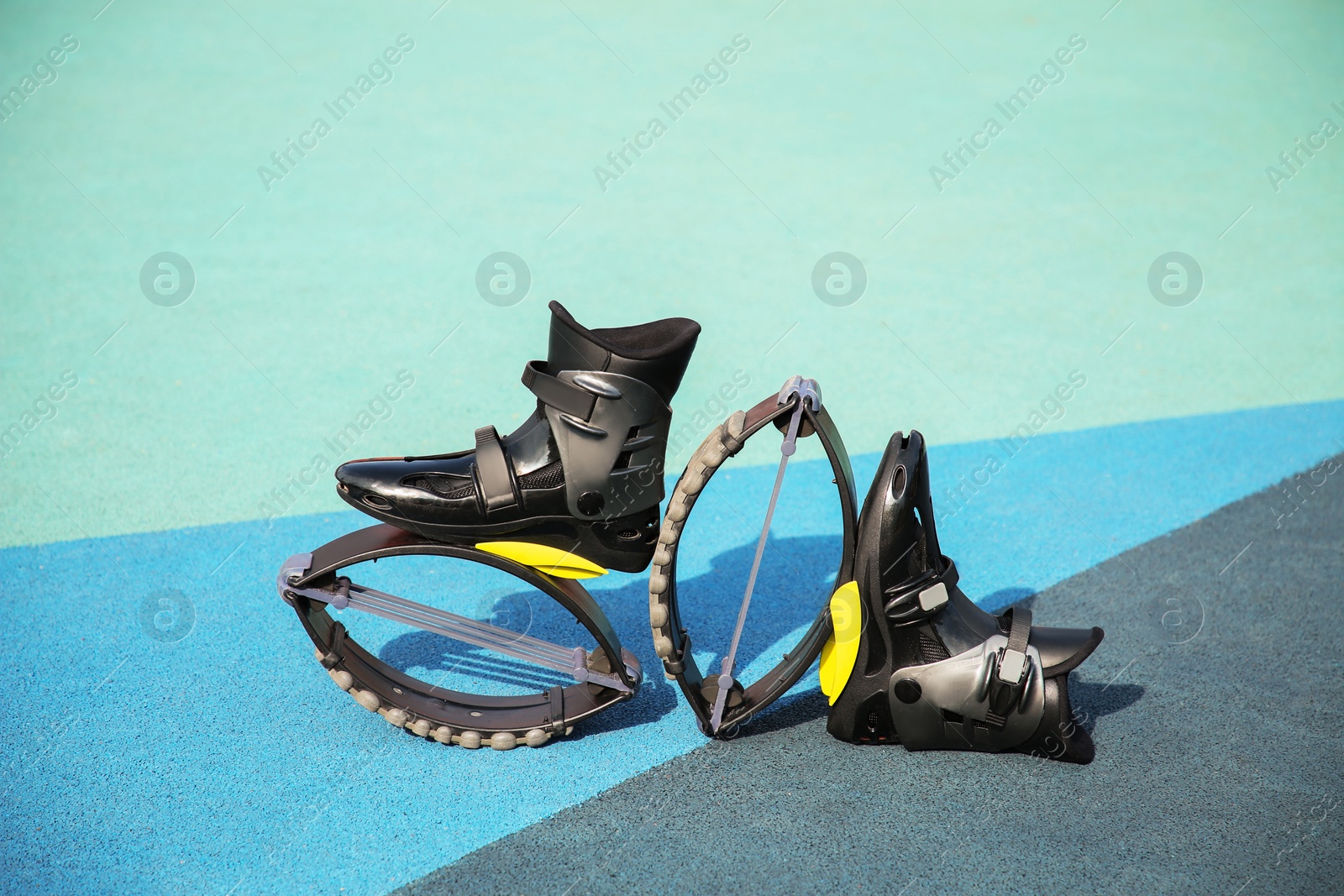Photo of Stylish kangoo jumping boots on color textured background
