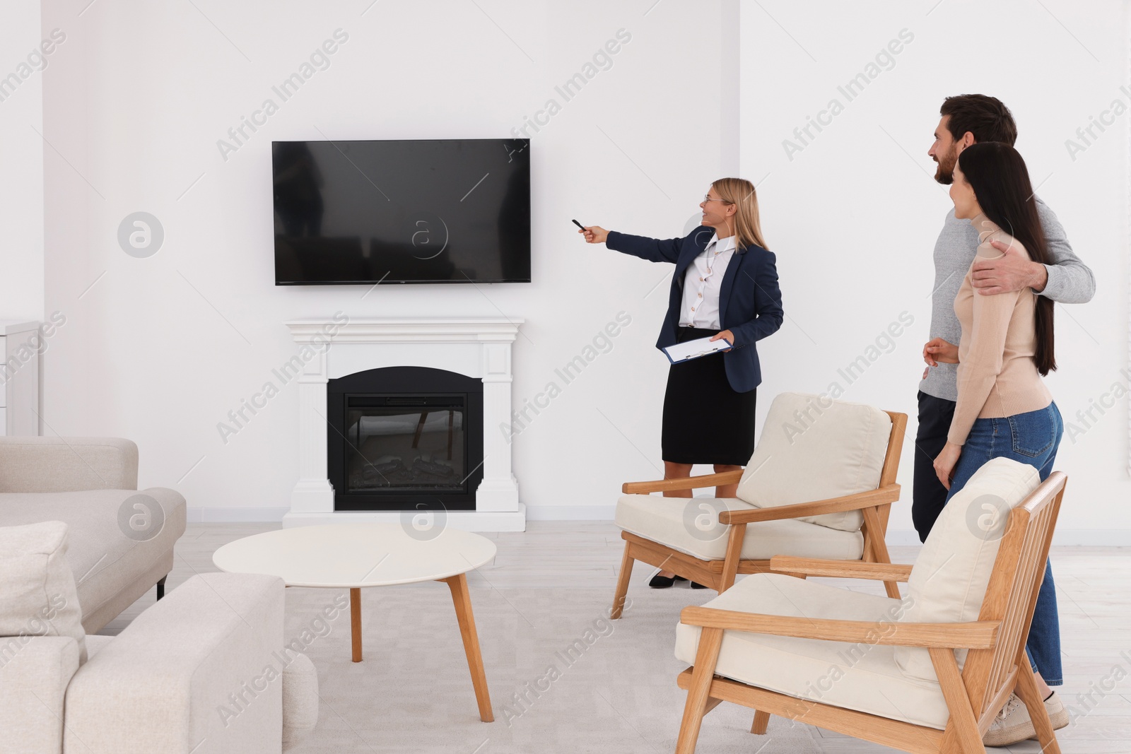 Photo of Real estate agent showing new apartment to couple