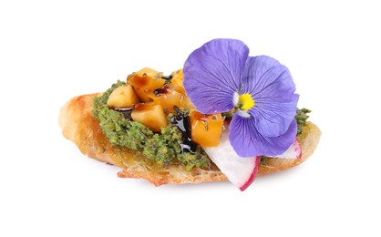 Photo of Delicious bruschetta with pesto sauce, tomatoes, balsamic vinegar and violet flower on white background