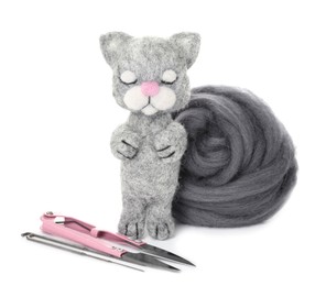 Needle felted cat, wool and tools isolated on white