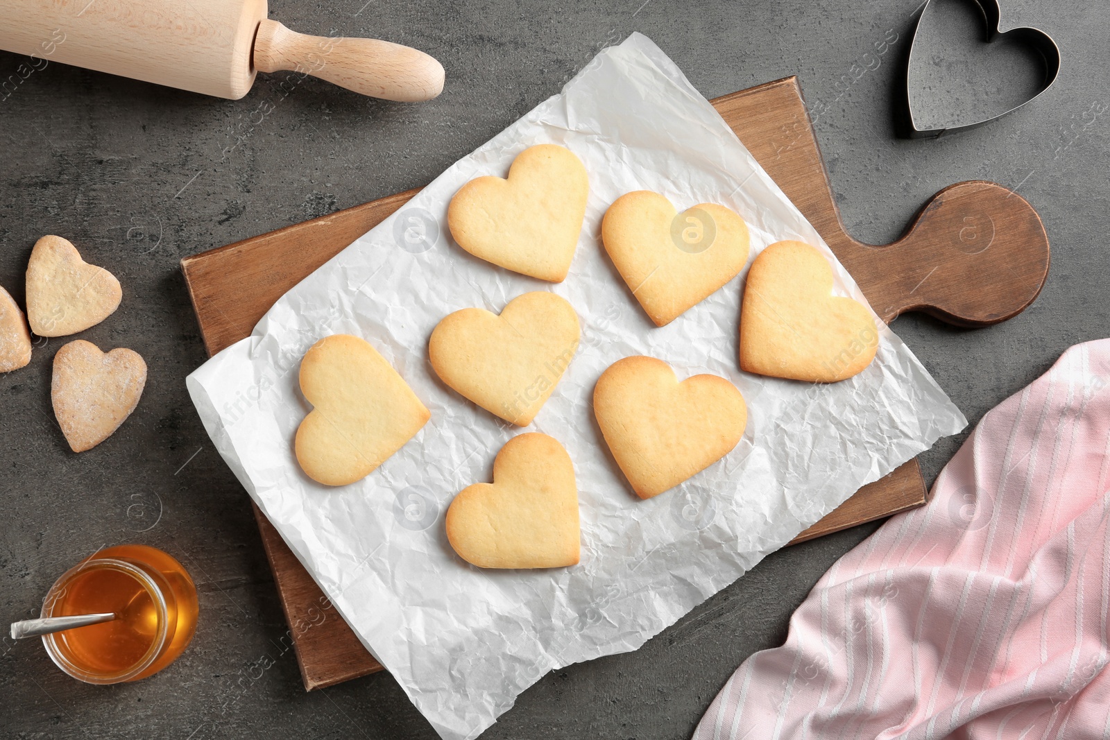 Photo of Flat lay composition with homemade heart shaped cookies on table