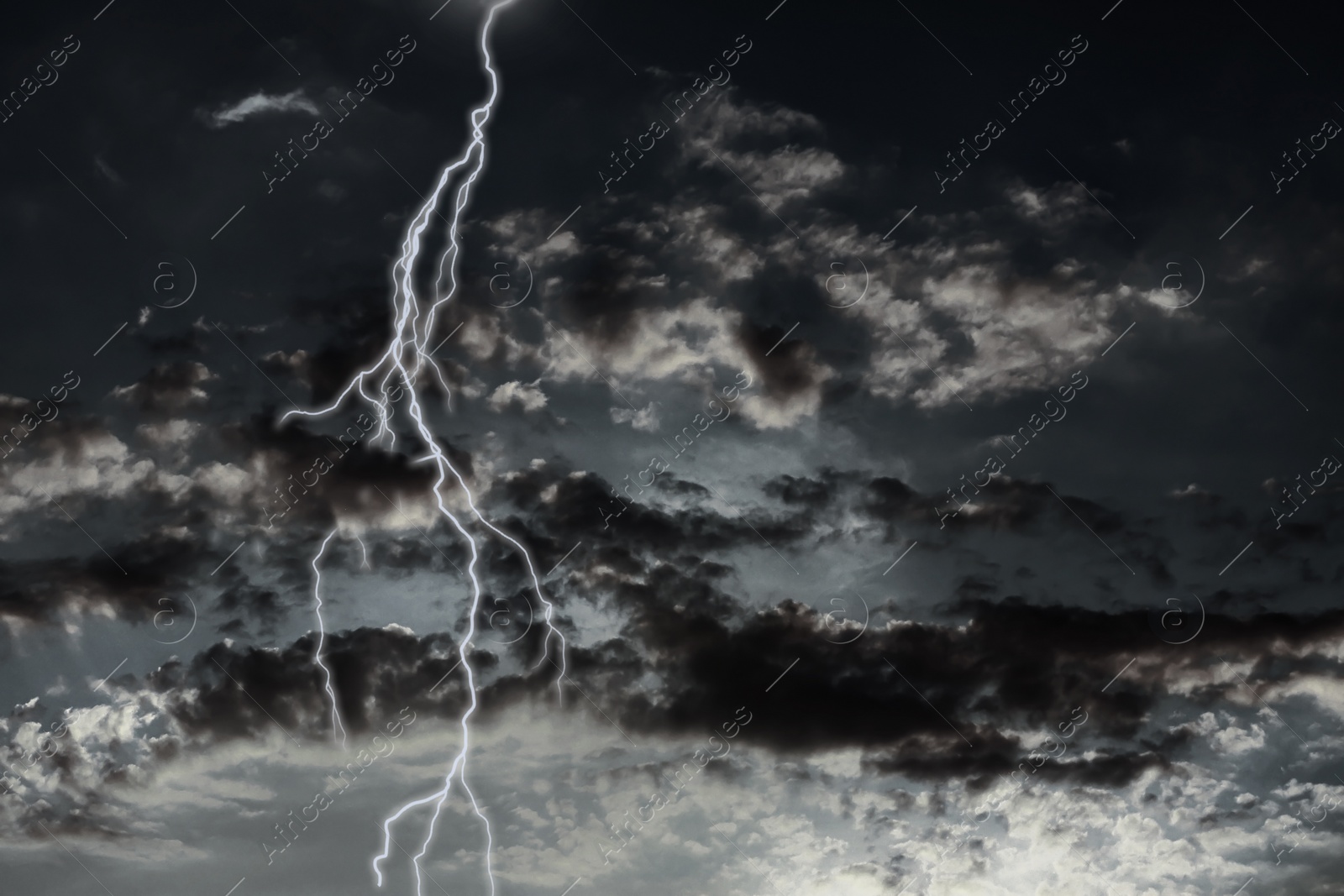 Image of Lightning in sky covered with rainy clouds. Stormy weather