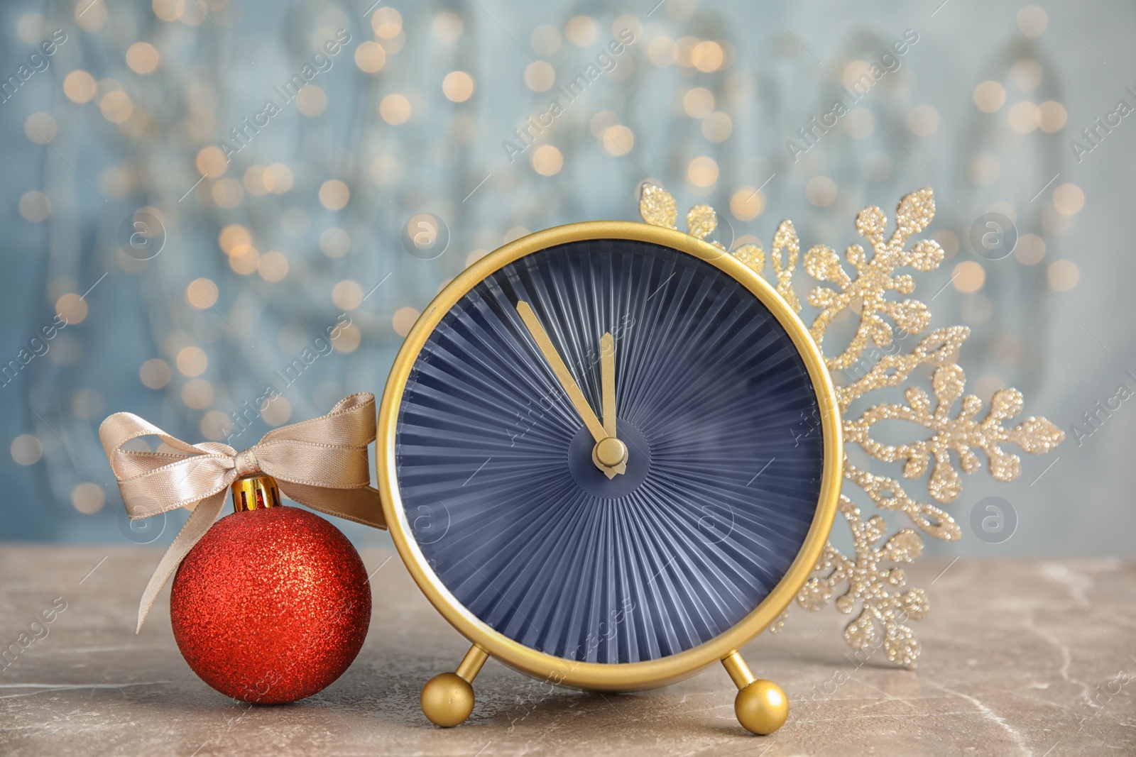 Photo of Alarm clock and decorations on table. Christmas countdown