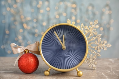 Alarm clock and decorations on table. Christmas countdown