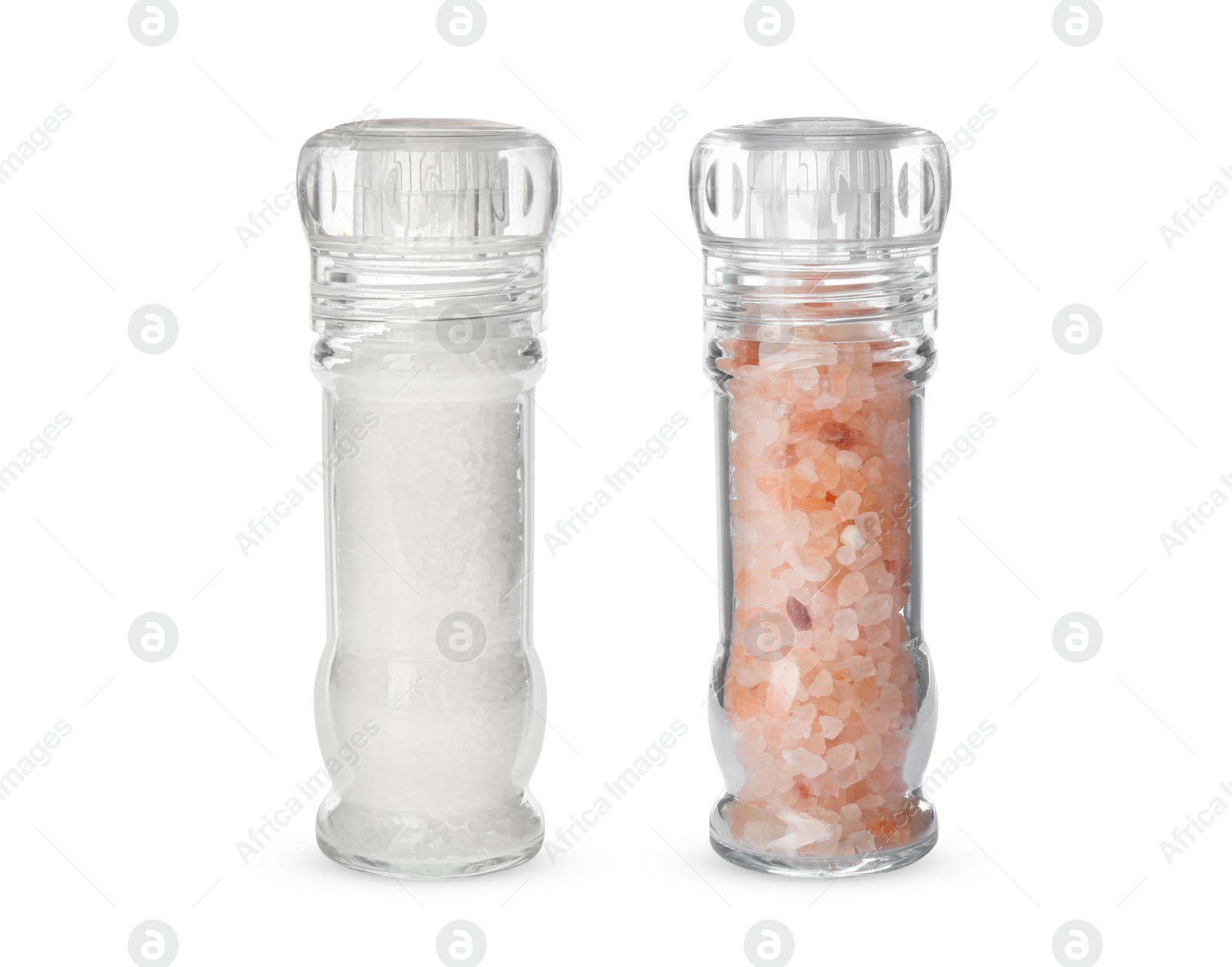 Image of Different salt in glass mill and shaker isolated on white